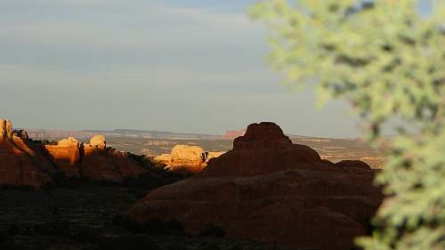 mountain brown fault block mountains during daytime moab